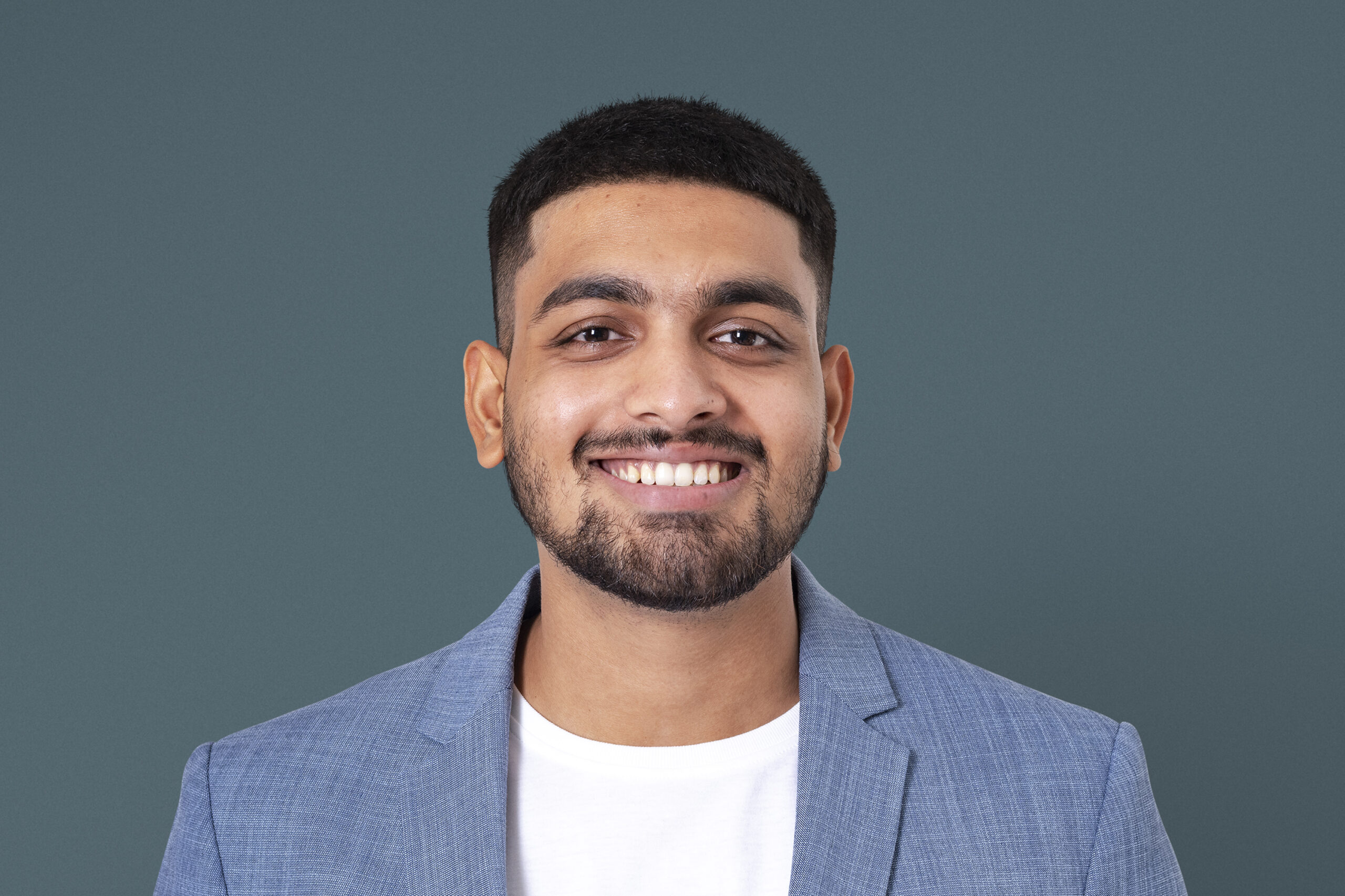 Cheerful Indian businessman smiling closeup portrait for jobs and career campaign